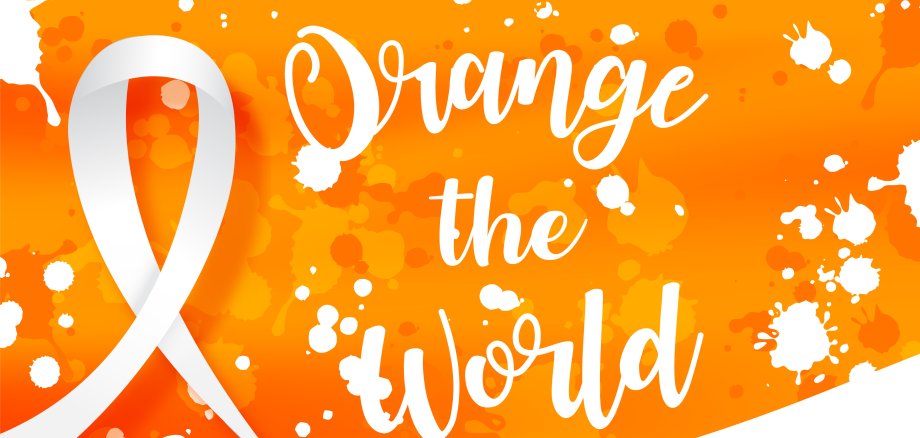 White ribbon with "Orange the world" letters and wording about "International day for the elimination of Violence Against Women" in poster and vector design on white splash and orange background.