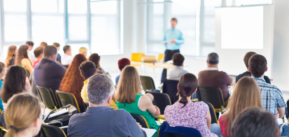 Speaker Giving a Talk at Business Meeting.