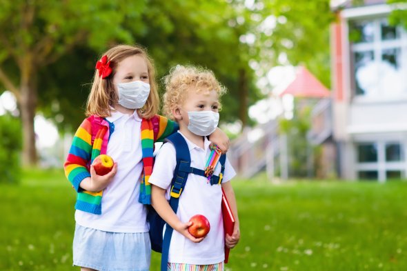 Kids on first school day in face mask Kids on first school day in face mask