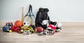 Different Type Of Sports Equipment On Wooden Desk Different Type Of Sports Equipment On Wooden Desk