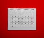 Weißer Kalender vor rotem Hintergrund.