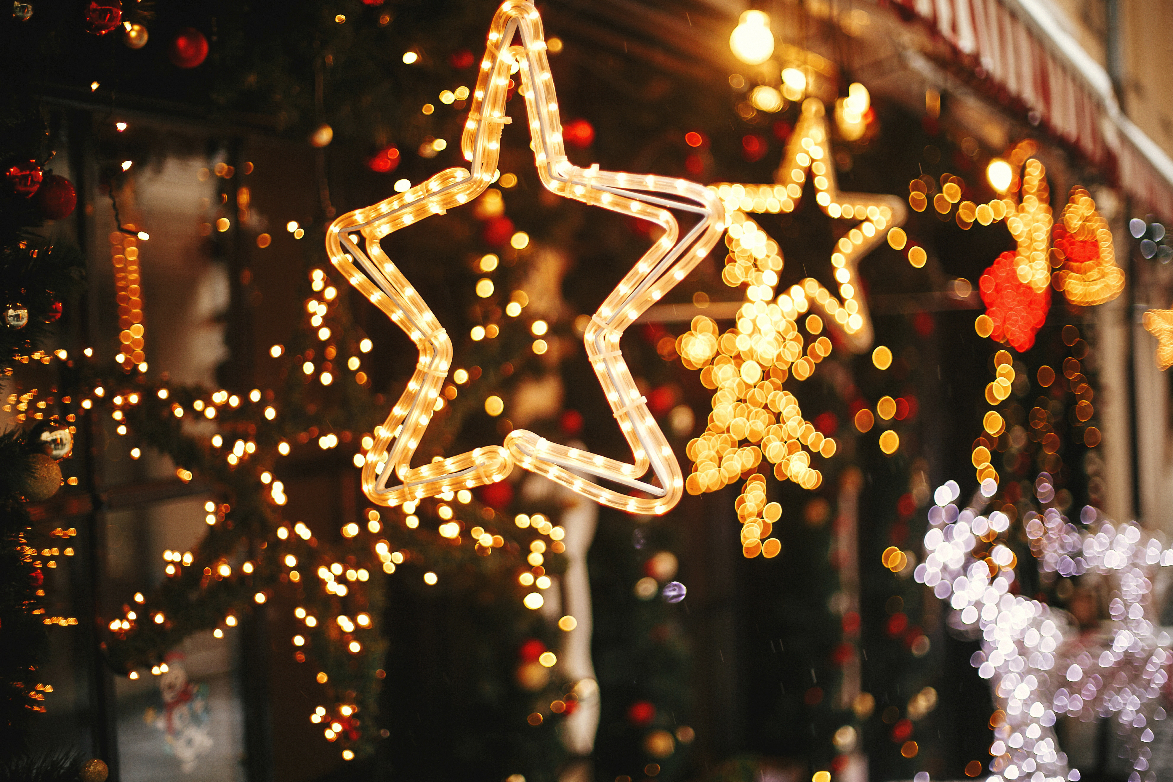 Stylish christmas golden star illumination and fir branches with Stylish christmas golden star illumination and fir branches with
